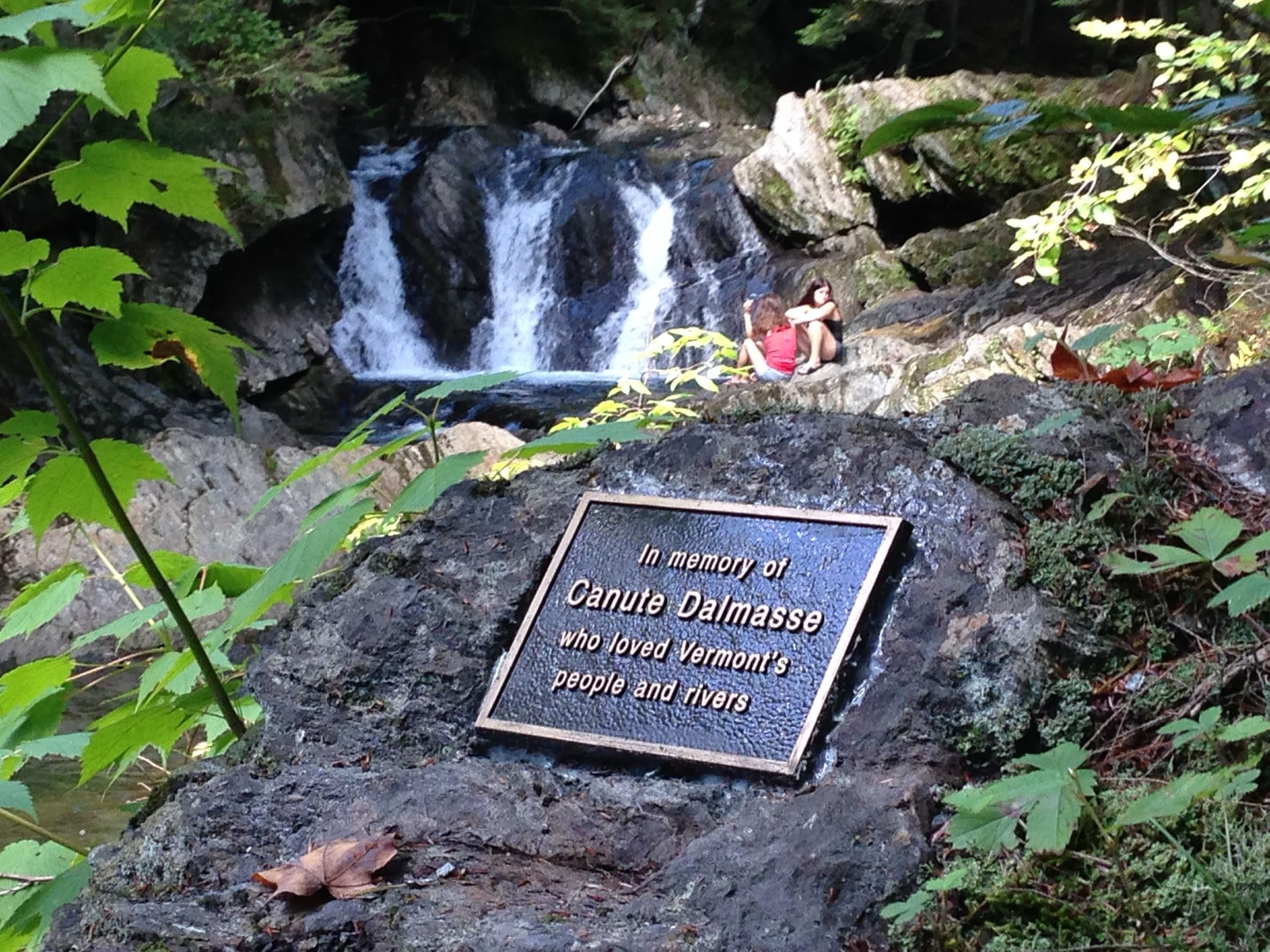 Canute Dalmasse memorial plaque beside the falls at Journey's End Swimming Hole.