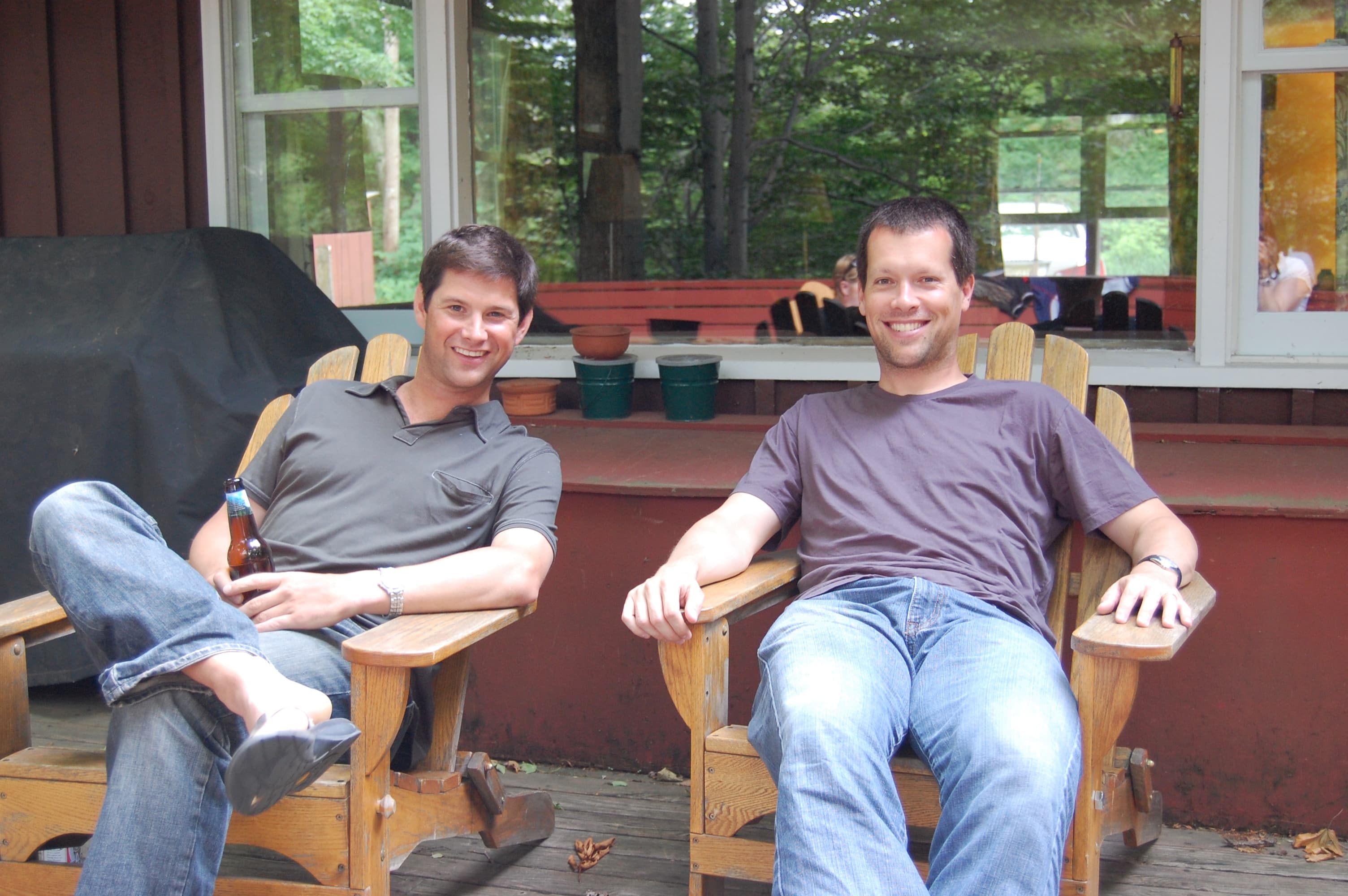 Summer scene along the Mad River near Waitsfield, Vermont, with people gathered at the water’s edge and forested banks.